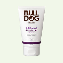 A 125 ml white tube of Oil Control Face Scrub for men, with charcoal and natural ingredients, features brown and purple text plus a simple logo. The tube stands upright against a light background.