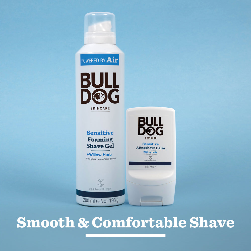 A can of Bulldog Sensitive Foaming Shave Gel with baobab oil and a bottle of Aftershave Balm are shown side by side on a light blue background, emphasizing a smooth, comfortable shave for sensitive skin.