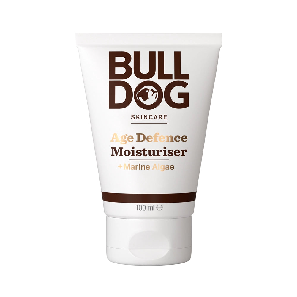 A 100ml tube of Age Defence Moisturiser for men, with a white background and bold brown and gold text on the packaging. Made from natural origin ingredients for effective anti-ageing care.