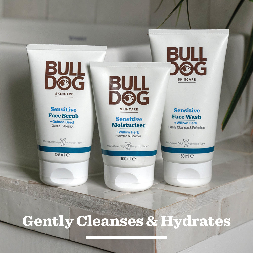 Bulldog Skincare Sensitive Face Wash, made with natural origin ingredients, is displayed on a bathroom counter. Text at the bottom reads, Gently Cleanses & Hydrates.