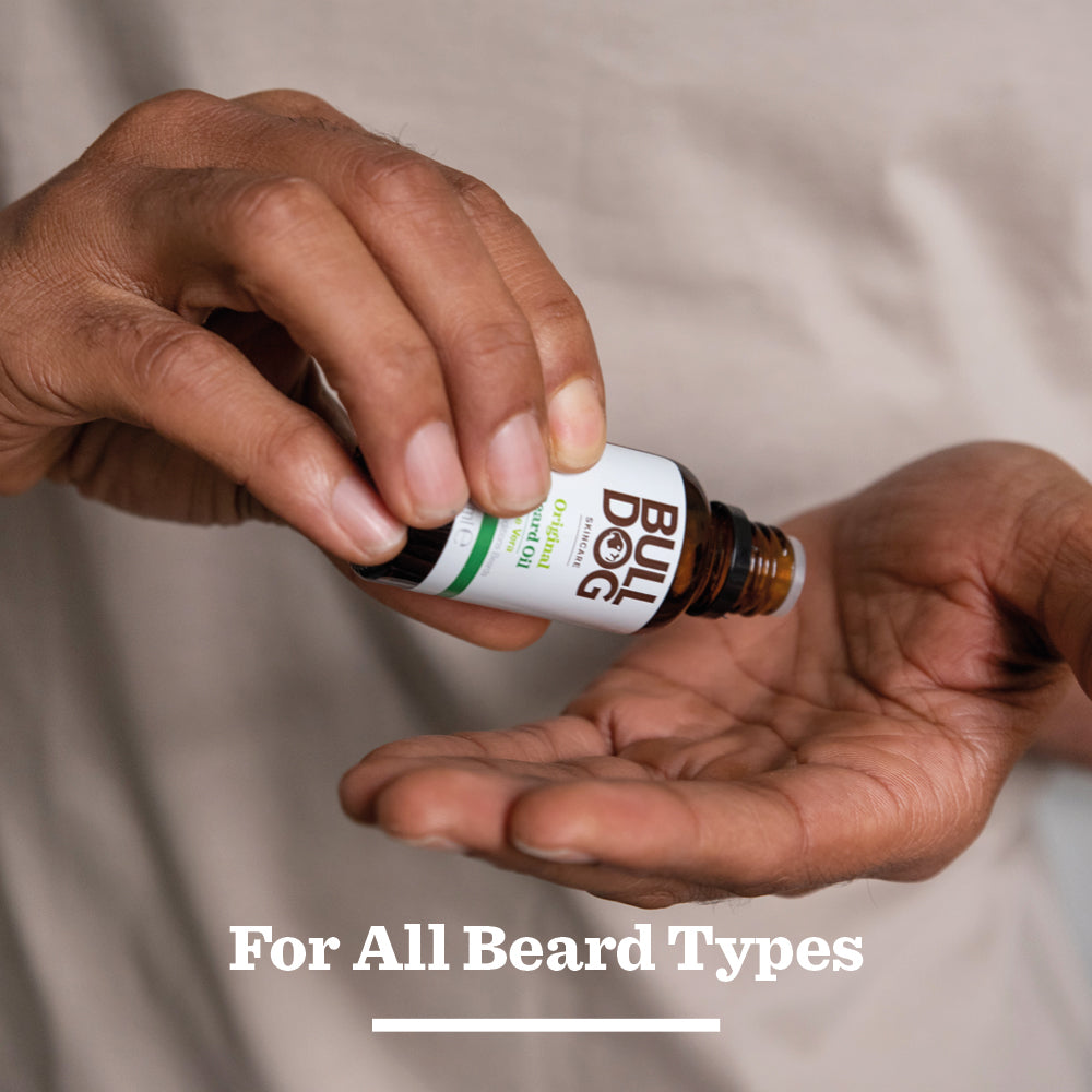 A person pours Original Beard Oil with natural ingredients into their palm, with the text For All Beard Types below.