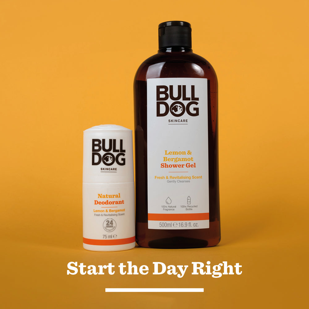 A stick of Bulldog Lemon & Bergamot Natural Deodorant and a bottle of shower gel are shown on an orange background above the text Start the Day Right, highlighting 24-hour odour protection for men.