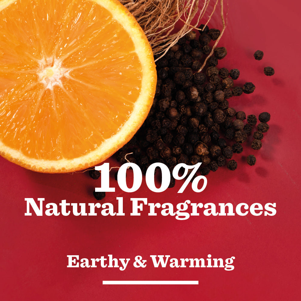 Half an orange and black peppercorns on a red background, with text: Vetiver & Black Pepper Natural Deodorant—100% natural fragrances, earthy & warming scent, and 24-hour odour protection.