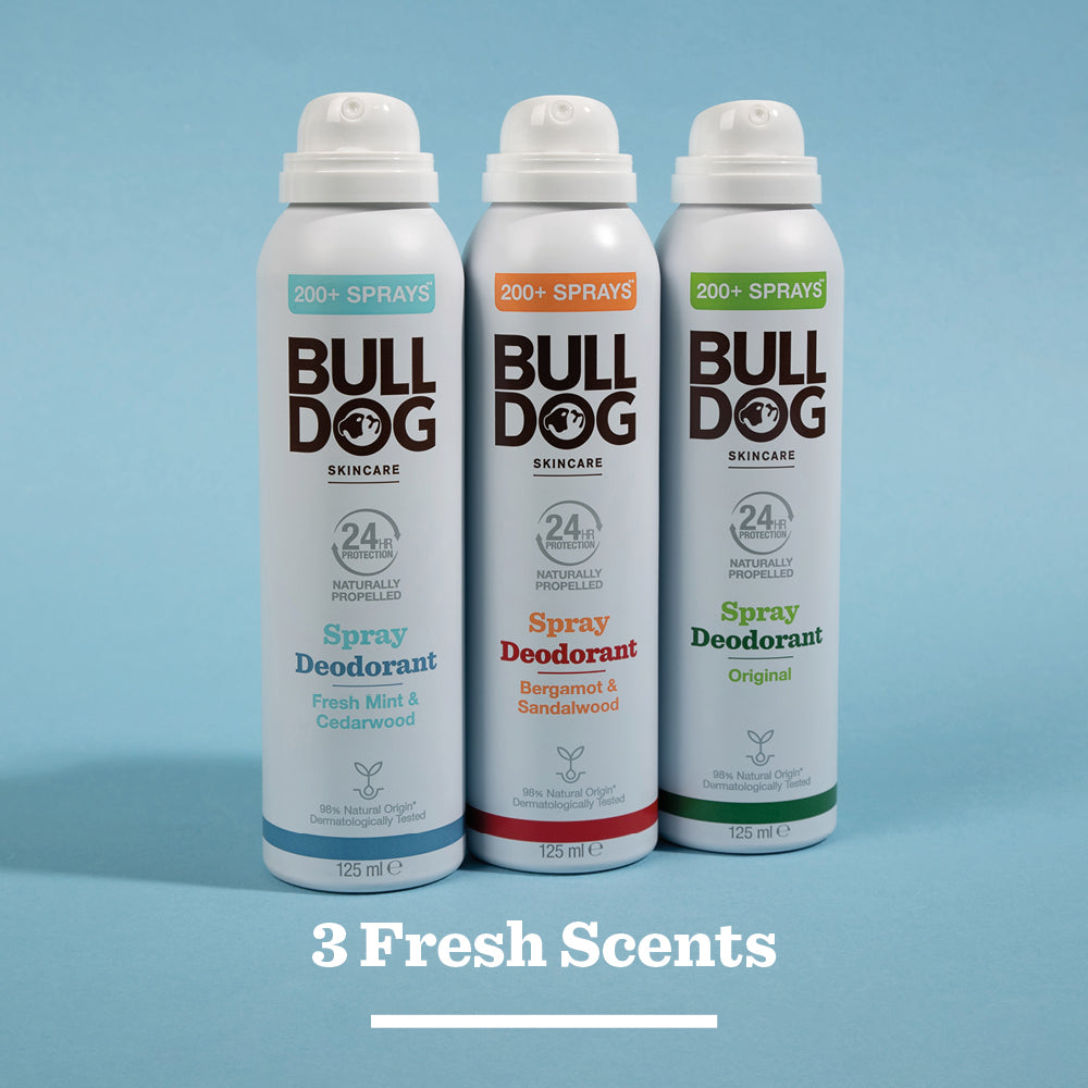 Three Bulldog spray deodorants stand side by side, each with a unique scent—Fresh Mint & Cedarwood, Bergamot & Sandalwood, and Original—all made with natural origin ingredients. Text below reads: 3 Fresh Scents.