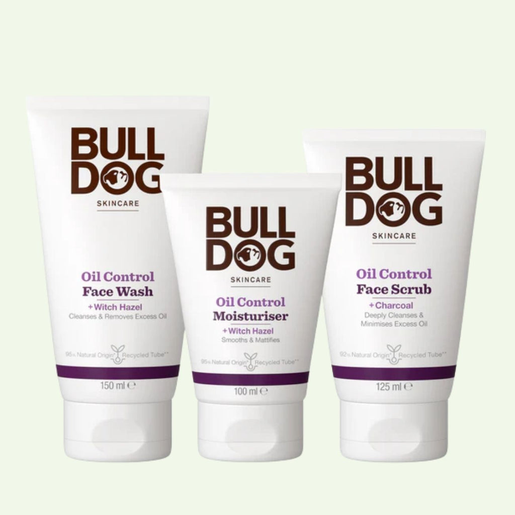 The Oil Control Skincare Bundle for oily skin includes Face Wash, Moisturiser, and Face Scrub with witch hazel, each in white tubes with black and purple text, displayed upright against a light background.