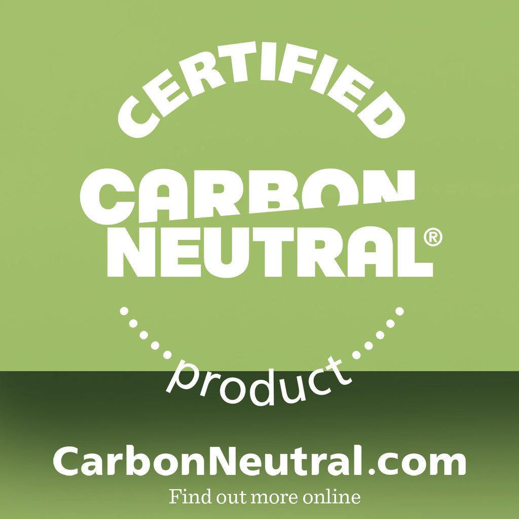 White text on a green background reads: Certified Carbon Neutral product. Featuring our Premium Shave Collection Bundle. CarbonNeutral.com. Find out more online. The bold font and circular layout highlight the message for emphasis.